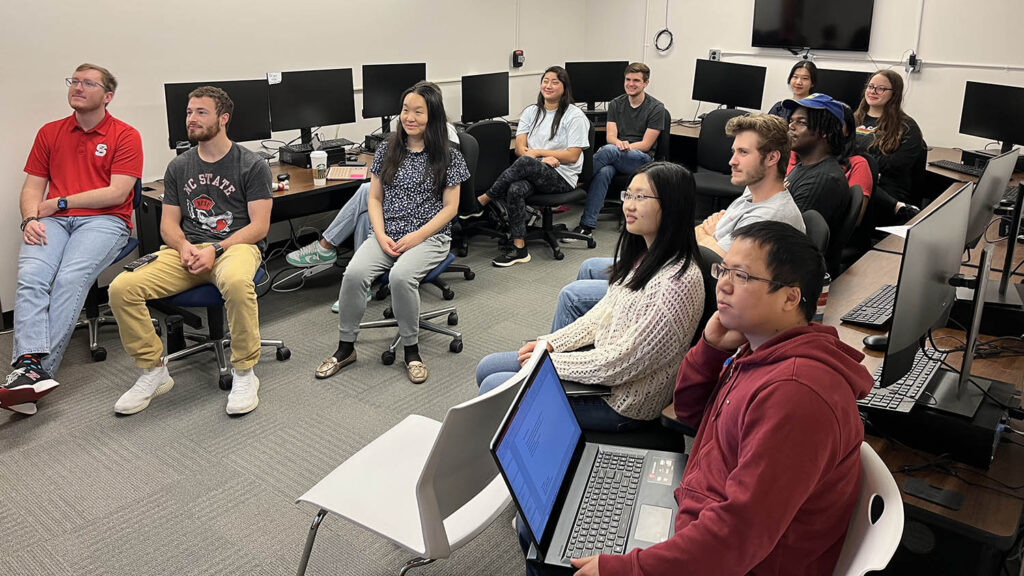 The Xiao lab members in the computer lab attending a presentation