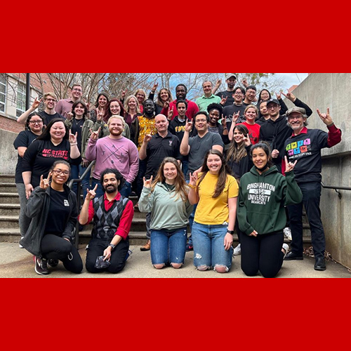 The image represents a group photo of the CGSA members and their friends wearing black, red, green, or gold to celebrate the black history month