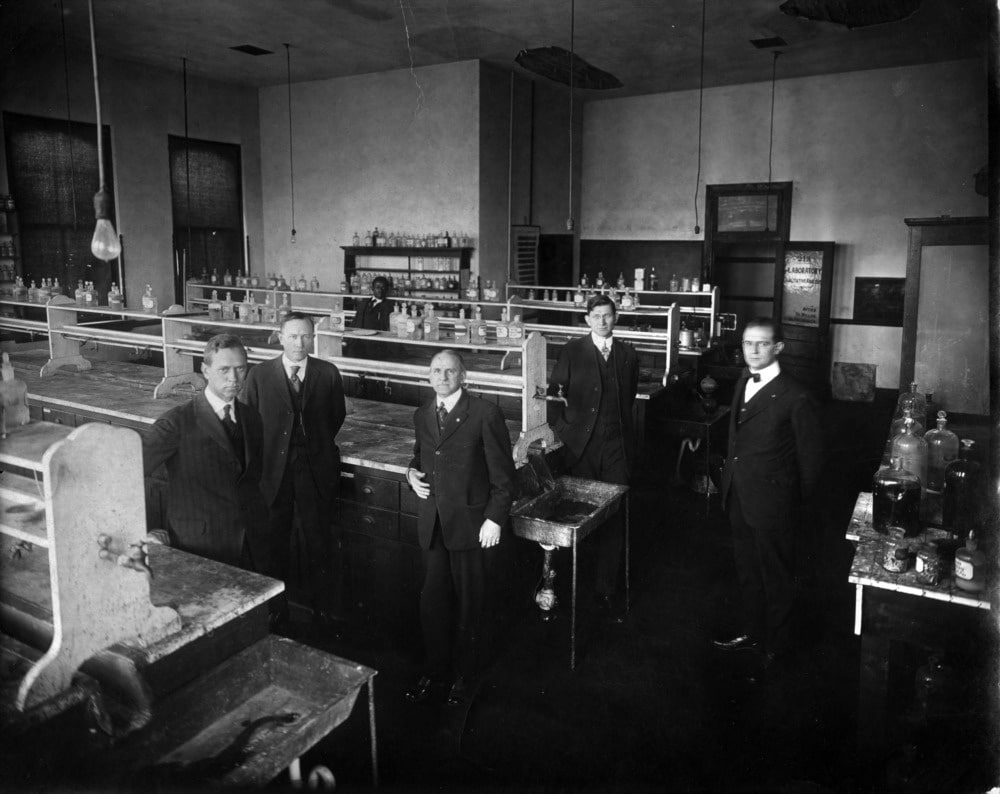 Professor W. A. Withers and staff in chemistry laboratory