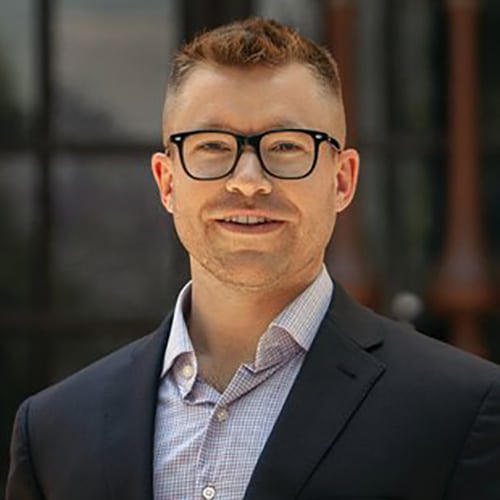 Headshot of a young man wearing eyeglasses