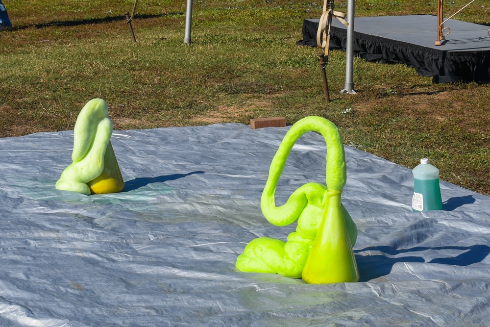 Green slime coming out of an Erlenmeyer flask