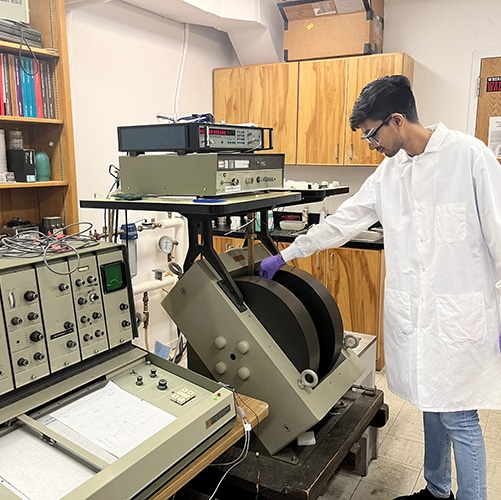 Chemistry student using a machine
